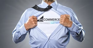 Businessman with tie tears his shirt, underneath a T-shirt with the inscription “BigCommerce” is visible.