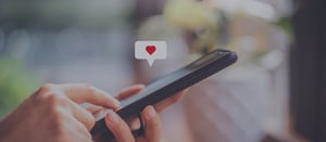 Image detail with smartphone and heart icon visualizes social networks